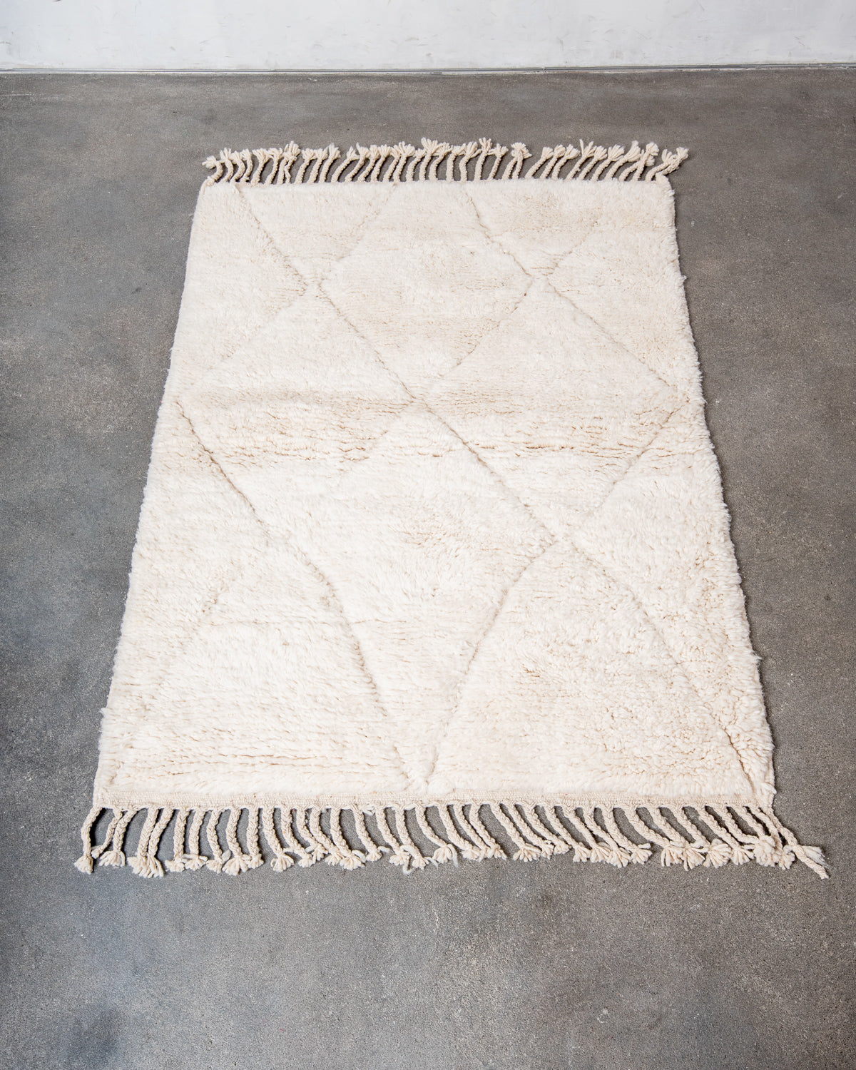 Modern, designer, handcrafted Berber rug from Morocco. Beniourain carpet with minimalist design, natural wool pile and a fluffy texture.